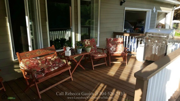 Country Properties for Sale in Renick WV - Relaxing is easy in the ample-sized covered front porch of this Renick country property for sale. 