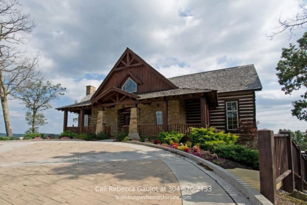 Front view of lodge-style clubhouse with brick-paved entrance and fencing, perfect for hosting events