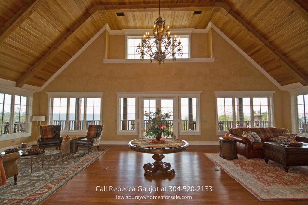 The interior look of the lodge-style clubhouse, with a small center table, and chairs on both sides